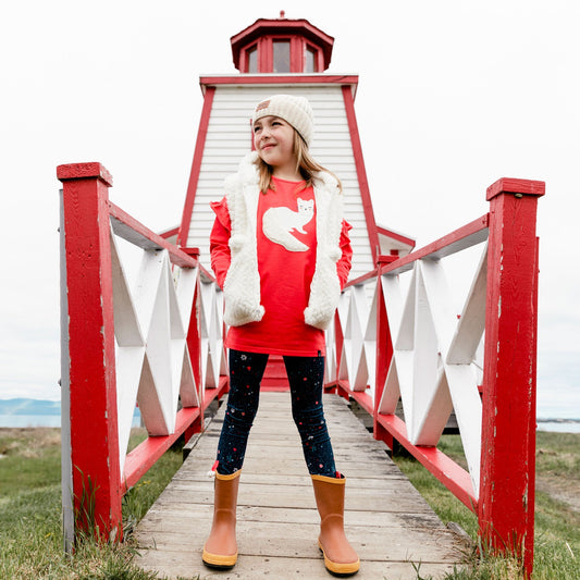 Ruffled sleeves lend playful charm to our Long Sleeve Tunic With Red Frill. This long sleeve top is made from a soft cotton/elastane blend.  Features dropped shoulders, a round neckline, and an adorable weasel print and applique on the chest.