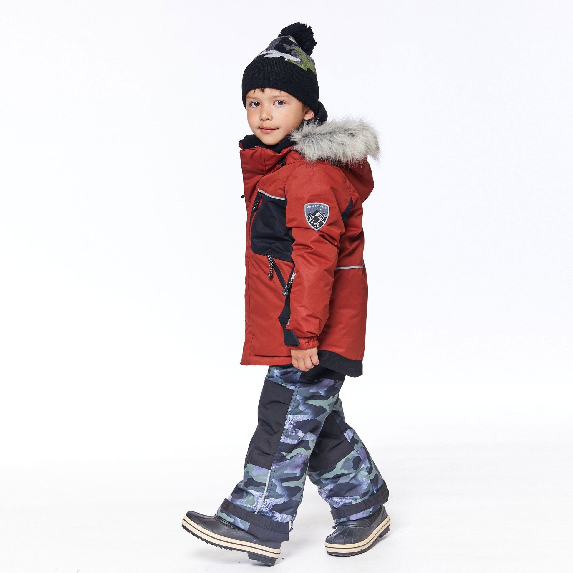 He'll look oh-so-cool and feel oh-so-warm when he's playing outdoors in our Two Piece Snowsuit Red and Khaki With Printed Camo.