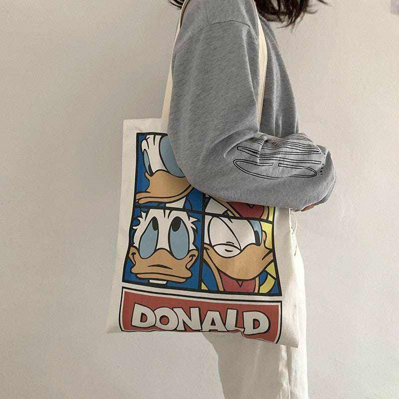 Spice up your eco-friendly lifestyle with any one or more of our Graphic Printed Canvas Tote Bags. Roomy and comfortable to wear. Your friends will be green with envy.