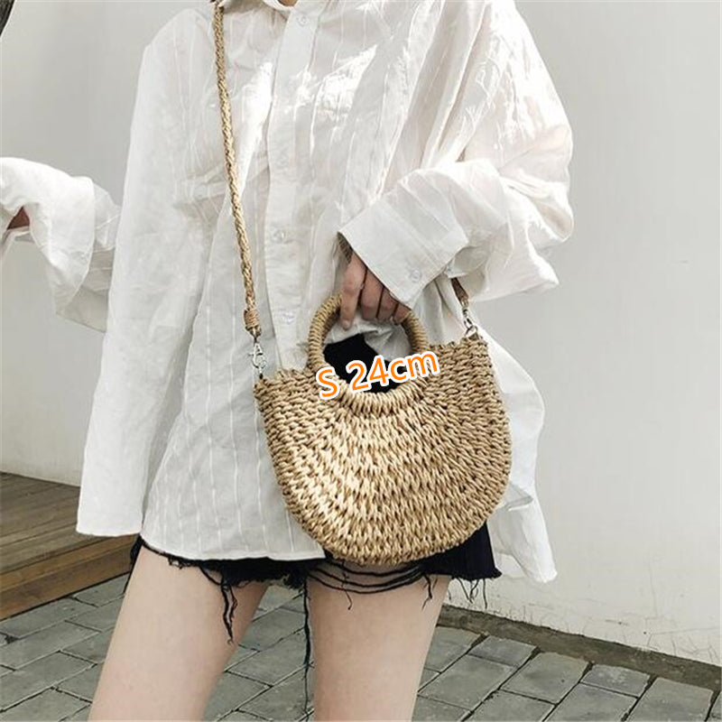 Half Moon Handmade Straw Handbags. These beautiful bags are woven by hand and feature a unique moon-shaped top handle.