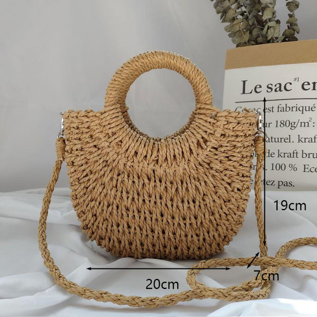 Half Moon Handmade Straw Handbags. These beautiful bags are woven by hand and feature a unique moon-shaped top handle.