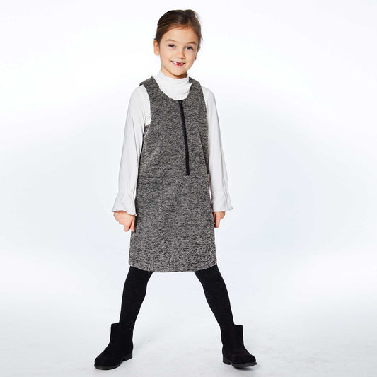 Sleeveless with a front zipper, our Herringbone Jumper With Pocket Black is easy to layer over any top or bodysuit. This jumper dress features wide, flat straps, a scoop neckline, and two patch pockets on the front.