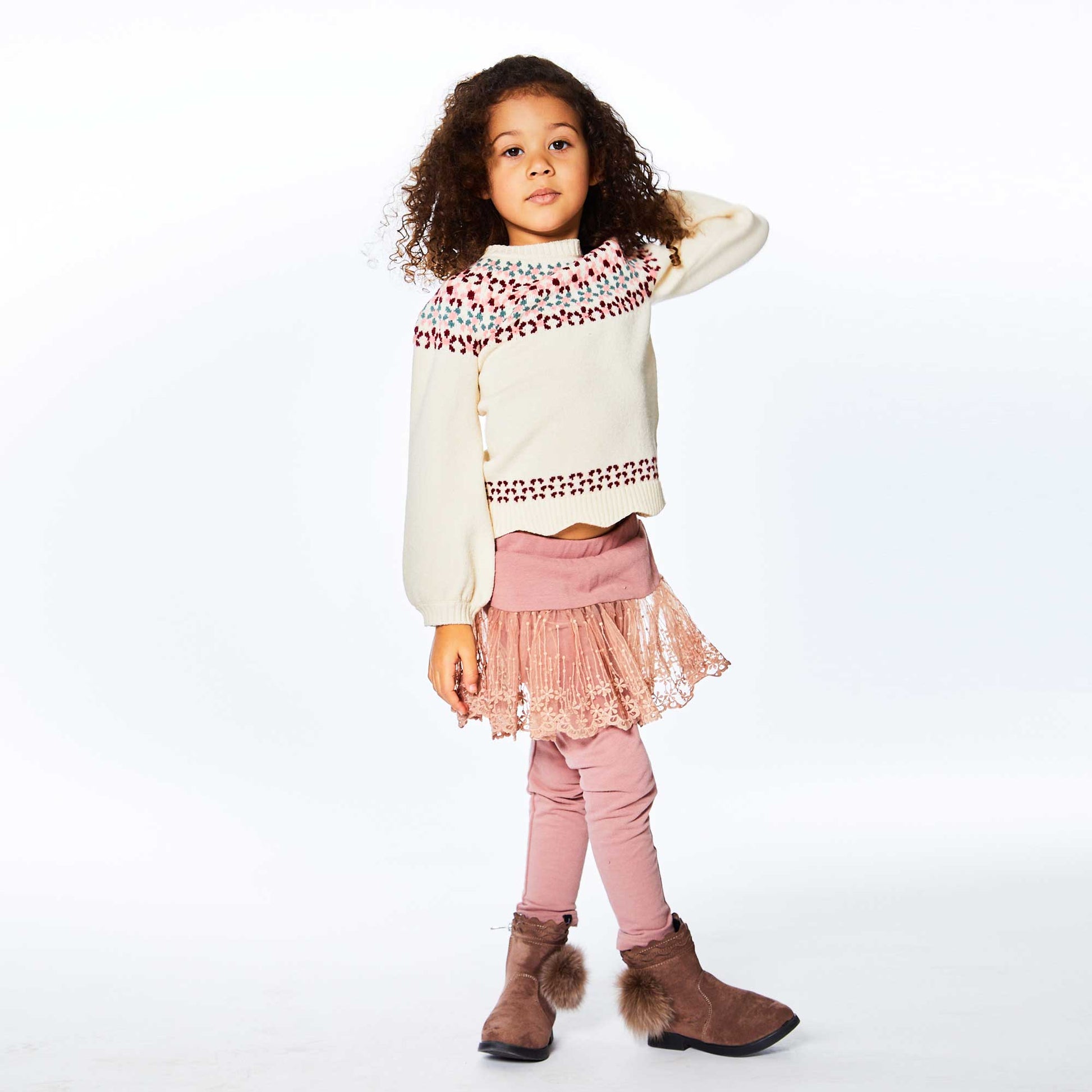 In stretch fleece with a lace overlay, our Lace Skirt Legging Antique Pink offers the perfect blend of casual comfort and girly style.  This legging features an easy pull-on fit with an elastic waistband, a mesh skirt with scalloped lace trim, and a logo label at the hem.