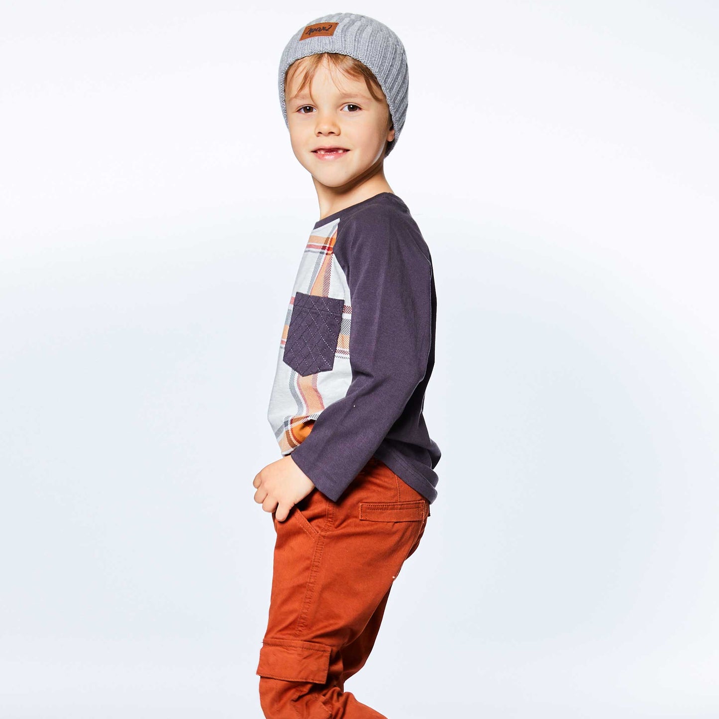 Add instant style to any boy's wardrobe with our Long Sleeve Raglan Jersey Top With Pocket Plaid. Made from soft cotton/elastane.  This jersey tee features contrast raglan sleeves, an allover plaid print, and a solid patch pocket on the chest.