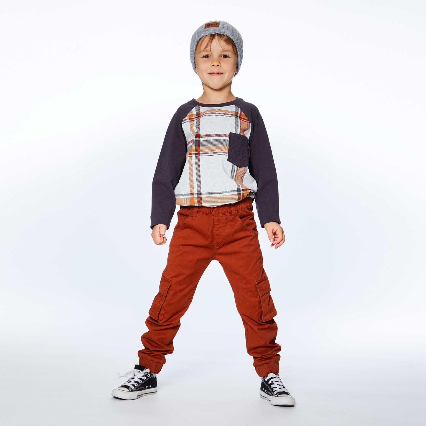 Add instant style to any boy's wardrobe with our Long Sleeve Raglan Jersey Top With Pocket Plaid. Made from soft cotton/elastane.  This jersey tee features contrast raglan sleeves, an allover plaid print, and a solid patch pocket on the chest.