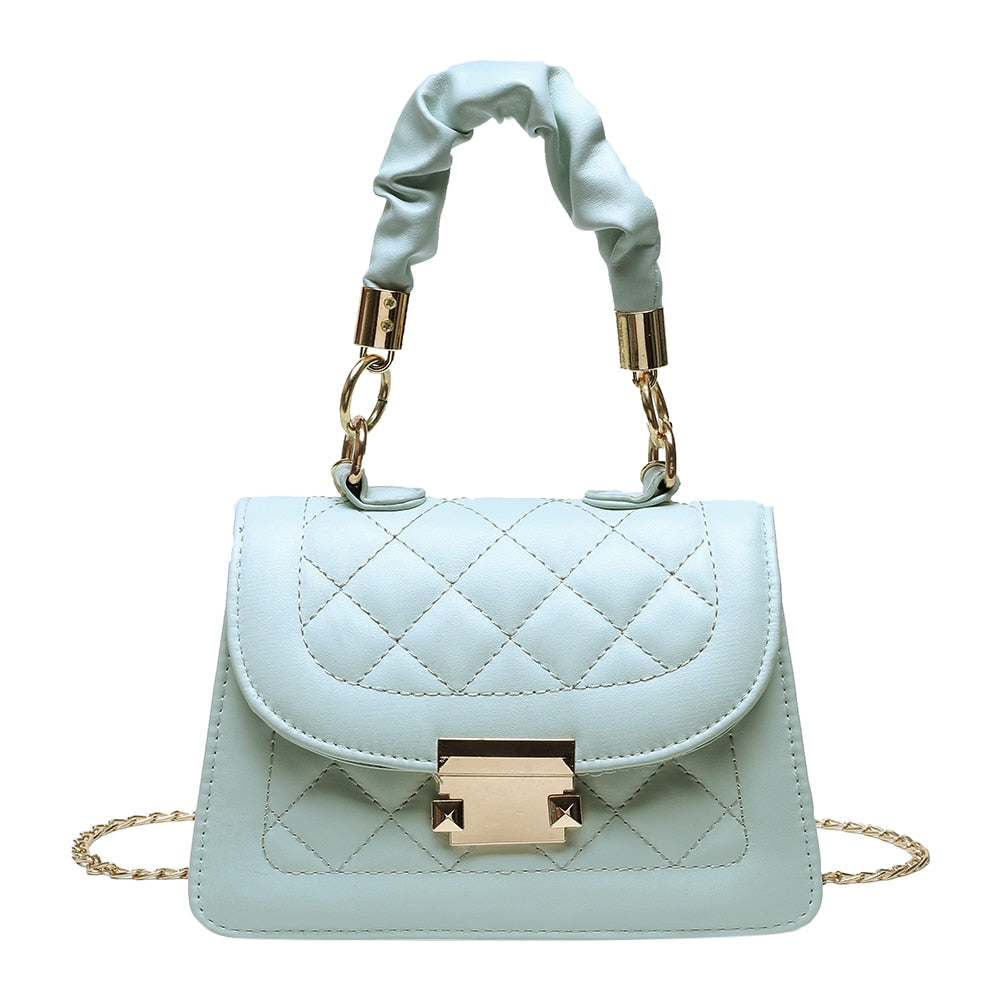 Made Them Look Mini Quilted Handbag. The quilted pattern and pleated handles give it a retro chic look that is sure to have them asking, "Where'd you get that from?"