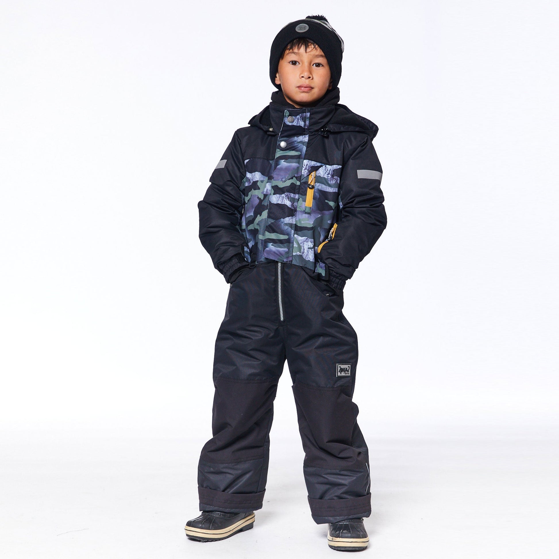 Little ones can enjoy the snow in style in our One Piece Snowsuit Printed Camo. Weather-resistant and insulated for warmth in sub-freezing temperatures.  This snowsuit features an adjustable inside waist, reinforced knees panels, rubberized elastic ankles, and a fleece lining for added warmth.