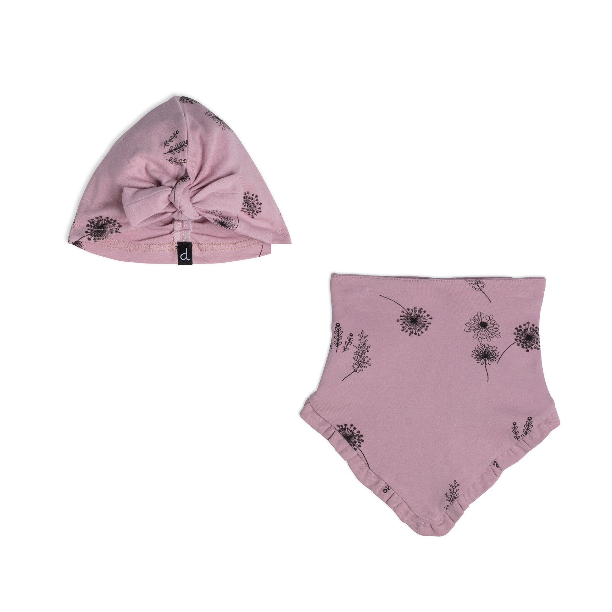 The Organic Cotton Hat and Bib Set Printed Flowers Dusty Purple features a soft hat with a bow on the front and a triangular bib with ruffle trim.