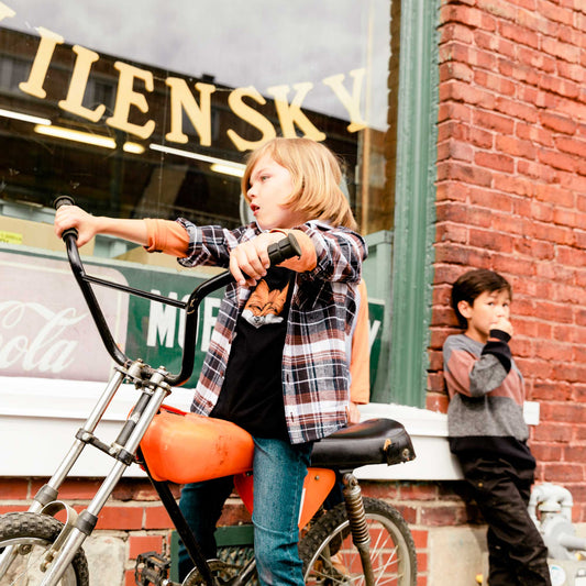 Our Plaid Shirt Brown and Black adds style and versatility to any boys wardrobe.  Worn buttoned up or open over a tee, this shirt features long sleeves, a button front placket, and two flap pockets on the chest.