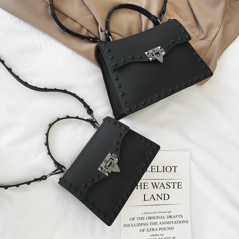 The Mini Sack Crossbody. Made from high quality PU leather, it is durable and built to last.